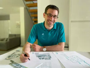 In Derby an architect is drawing a house extension design