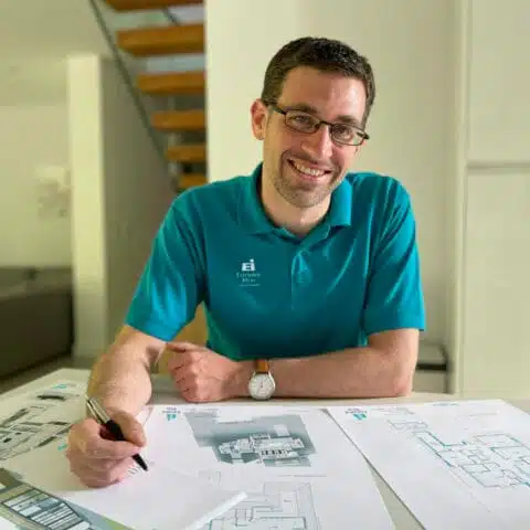 In Derby an architect is drawing a house extension design